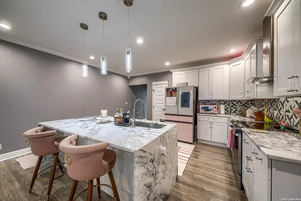 a kitchen with a table and chairs in it