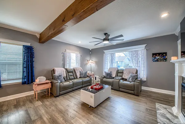 a living room with furniture and a window