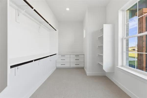 a view of walk in closet with window