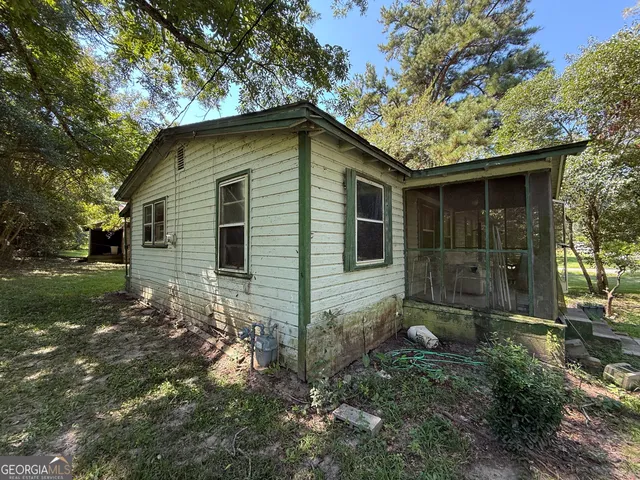 a backyard of a house with lots of green space