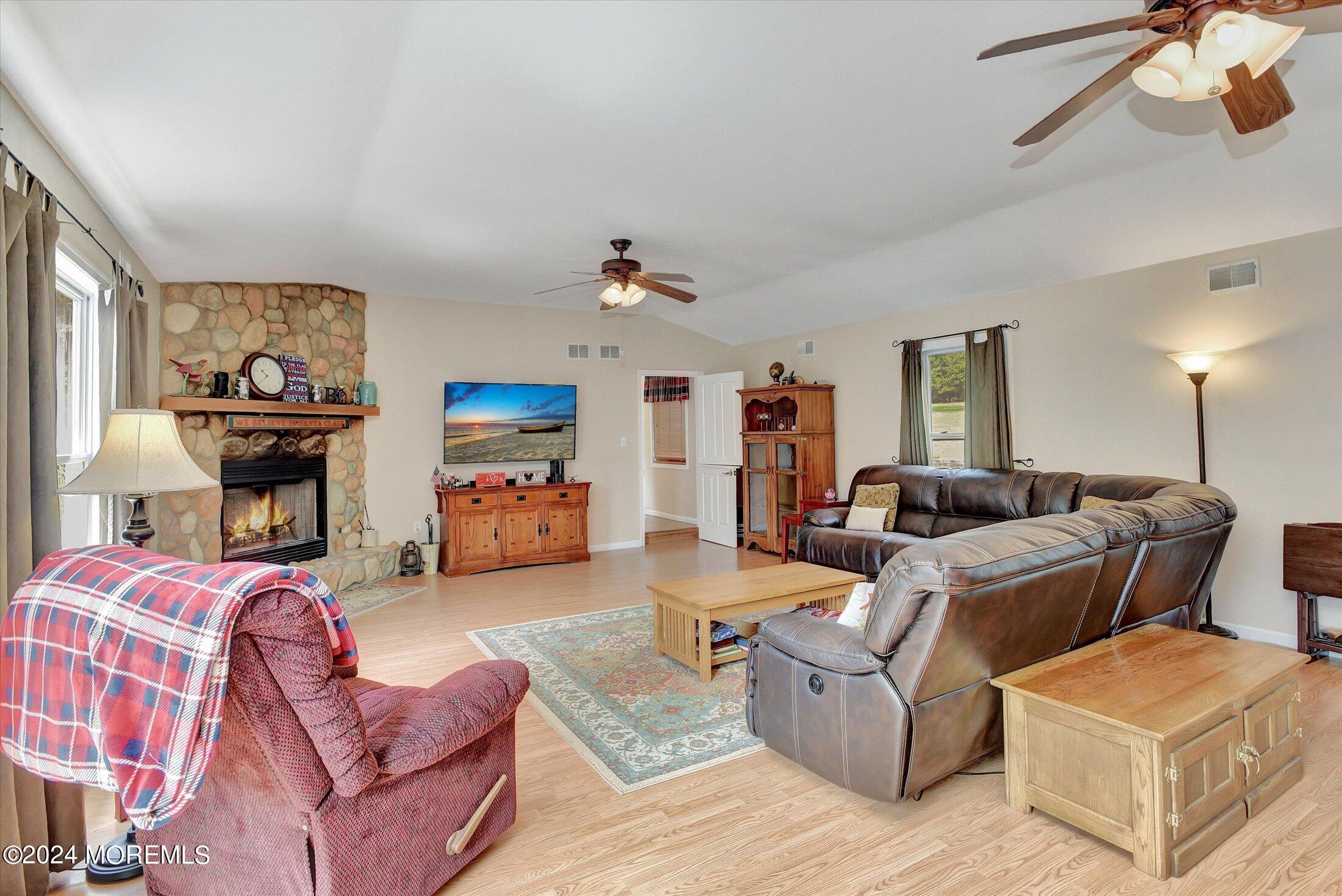 155 Tyrpak Road Howell, NJ 07731 - Photo 12 of 35 a living room with furniture and a chair