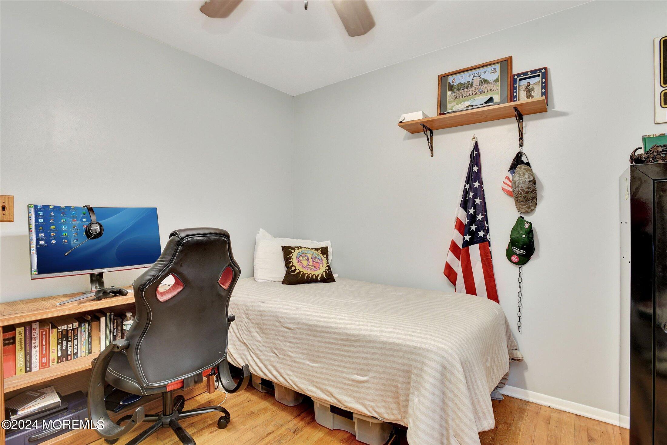 155 Tyrpak Road Howell, NJ 07731 - Photo 21 of 35 a bedroom with a bed and a book shelf
