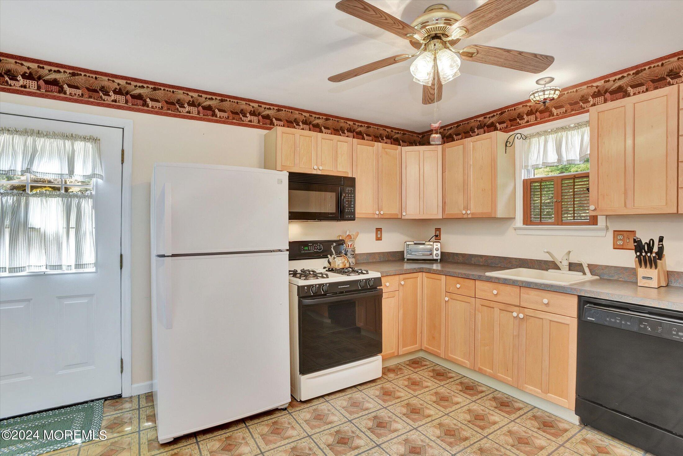 155 Tyrpak Road Howell, NJ 07731 - Photo 25 of 35 a kitchen with a sink appliances and cabinets