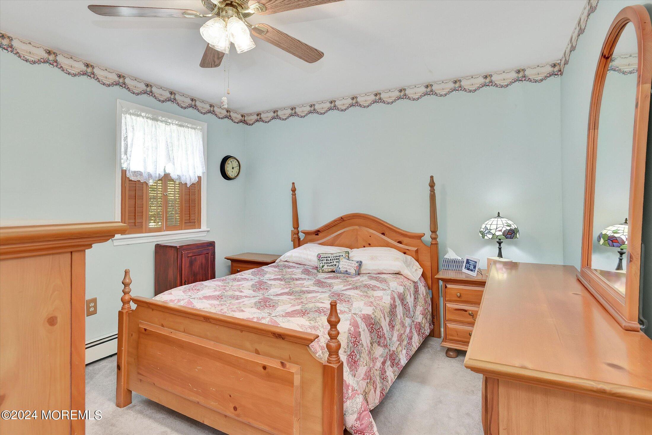 155 Tyrpak Road Howell, NJ 07731 - Photo 31 of 35 a bedroom with a bed and a chandelier