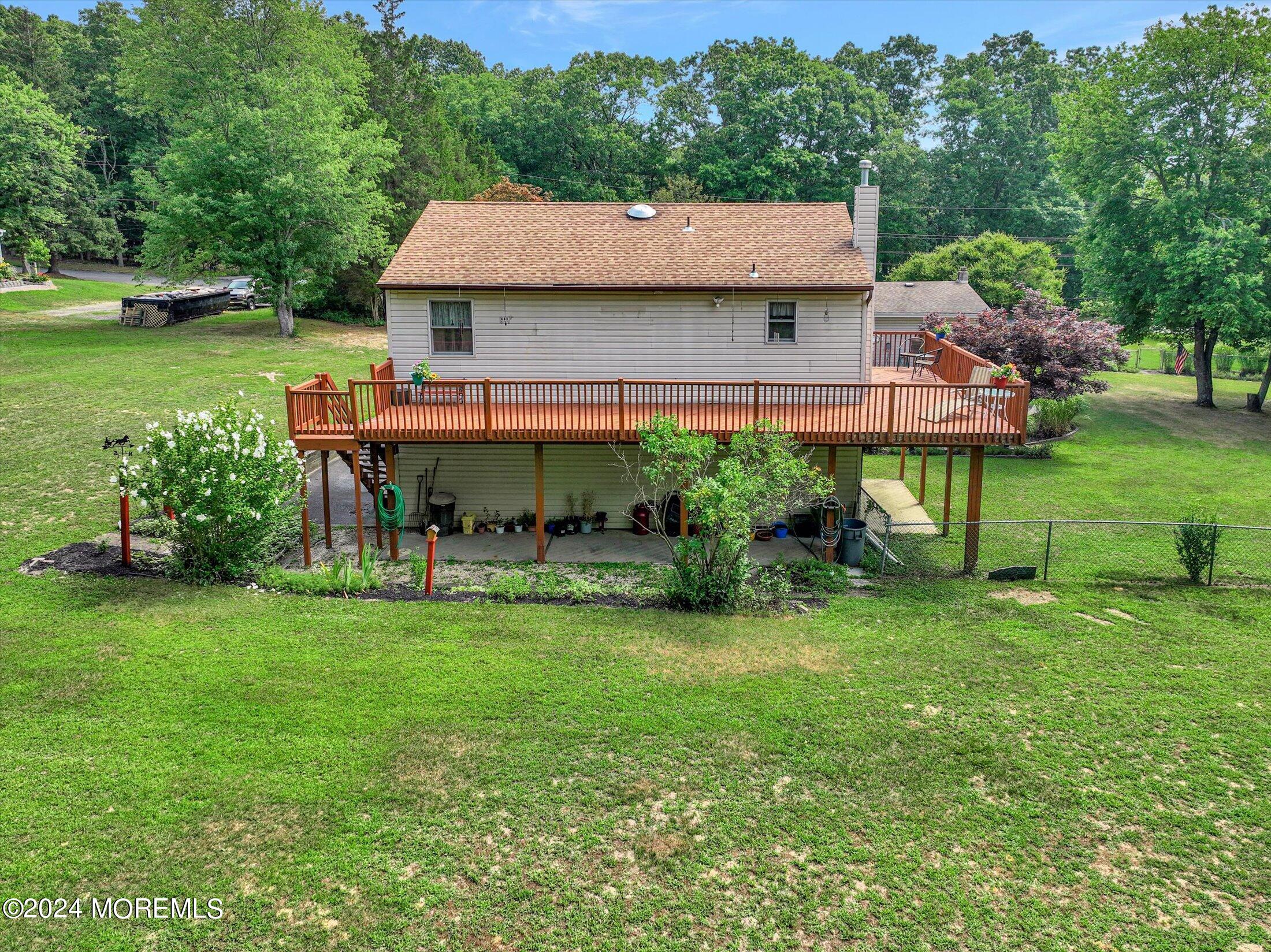 155 Tyrpak Road Howell, NJ 07731 - Photo 35 of 35 a view of house with backyard and outdoor seating