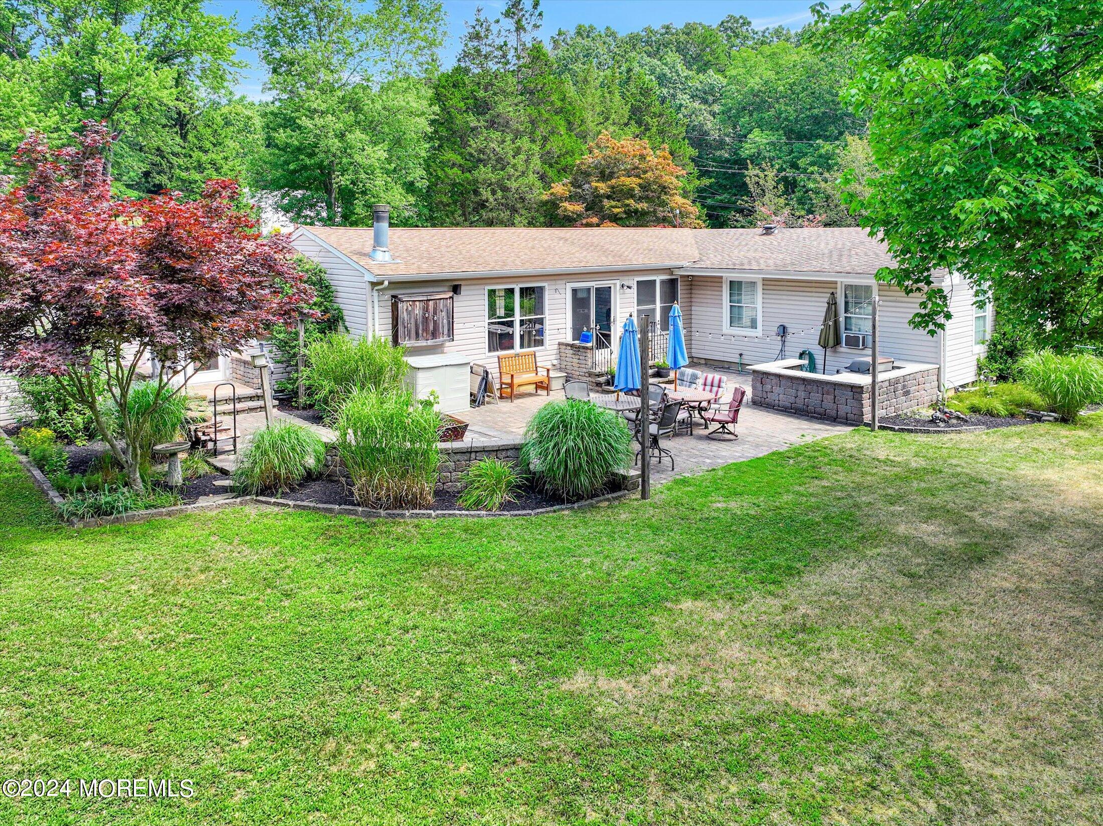 155 Tyrpak Road Howell, NJ 07731 - Photo 5 of 35 a view of a house with a yard and sitting area