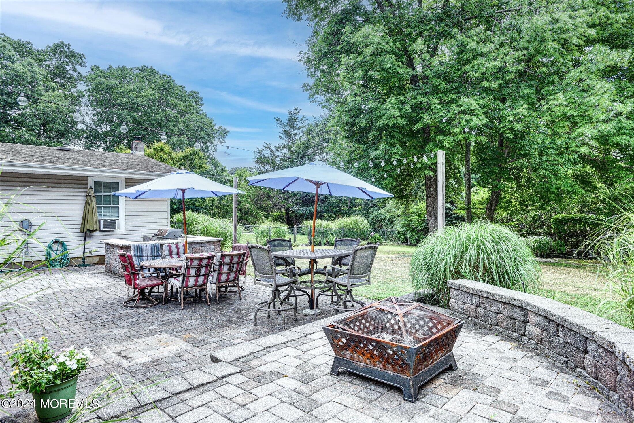 155 Tyrpak Road Howell, NJ 07731 - Photo 6 of 35 a backyard of a house with yard barbeque oven and outdoor seating