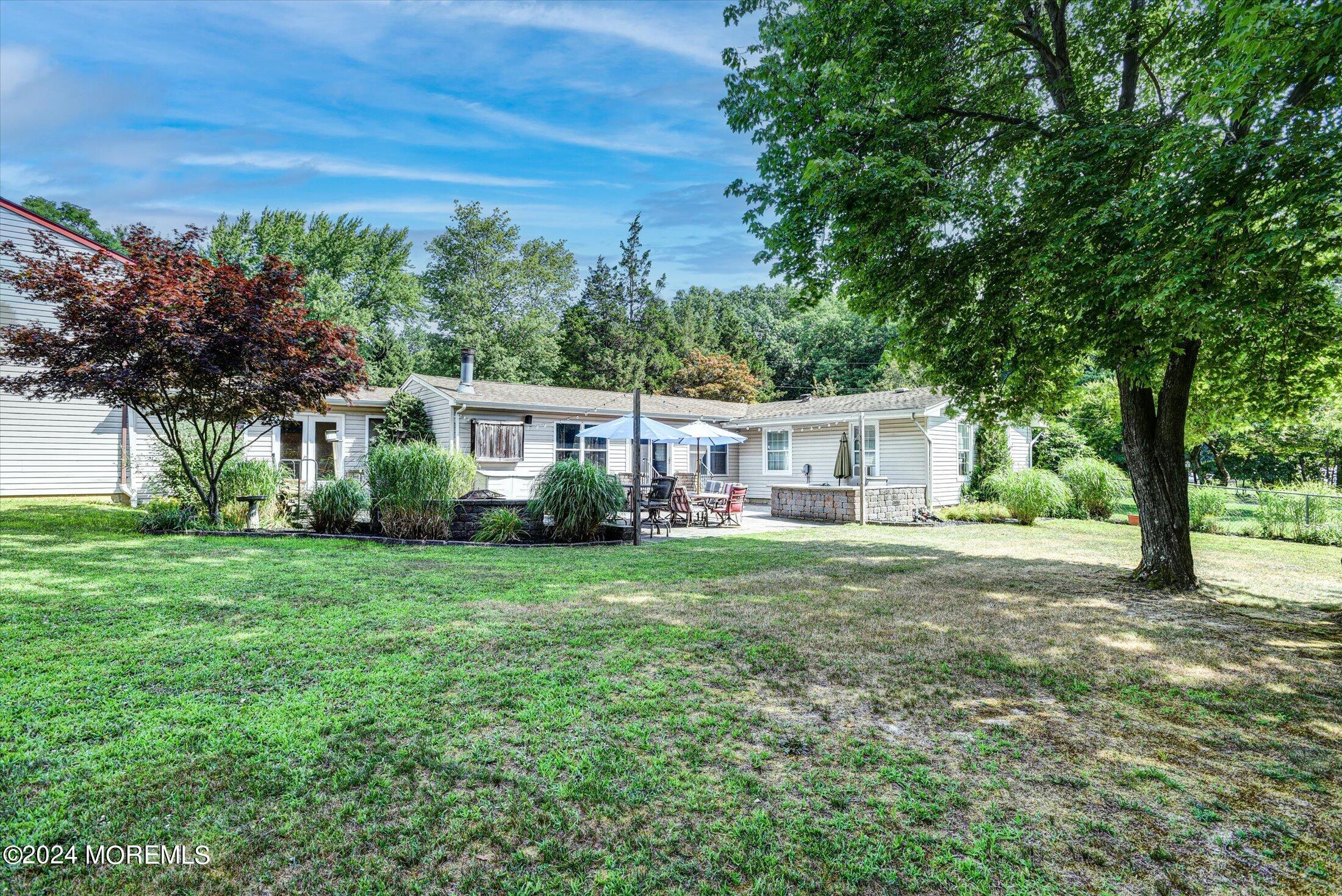 155 Tyrpak Road Howell, NJ 07731 - Photo 7 of 35 a front view of a house with a garden