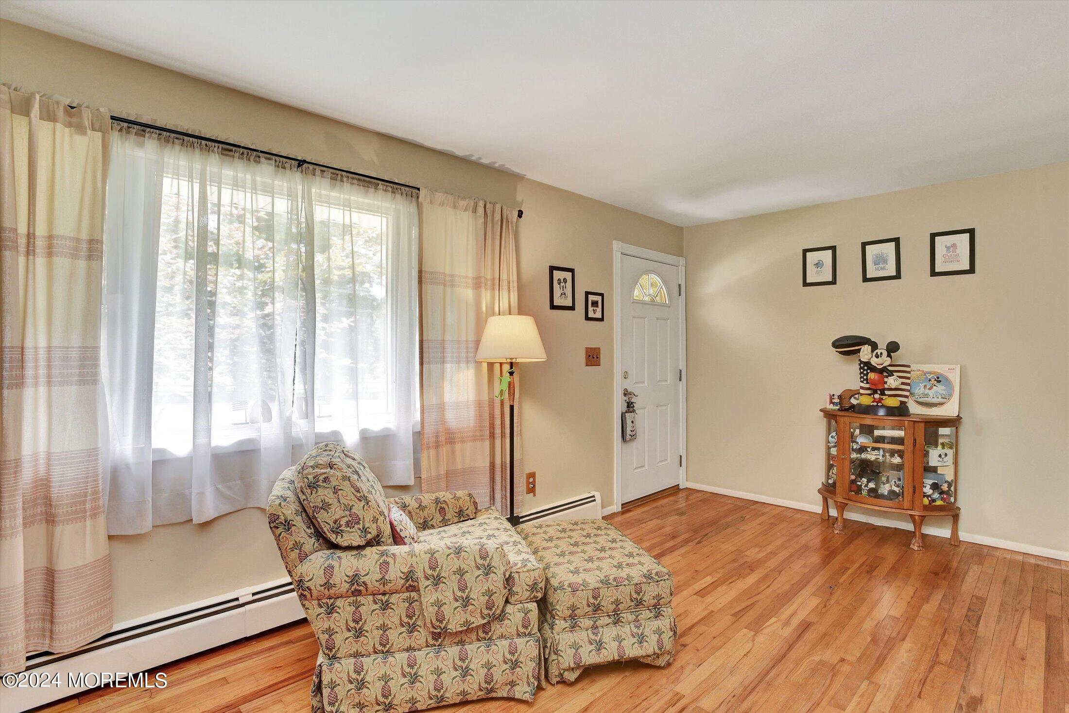 155 Tyrpak Road Howell, NJ 07731 - Photo 8 of 35 a bedroom with a bed and wooden floor