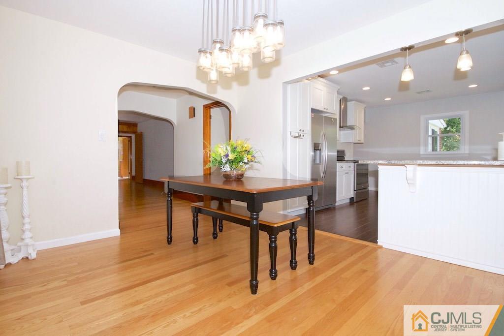96 Smith Road Somerset, NJ 08873 - Photo 3 of 25 a view of a dining room with furniture and wooden floor