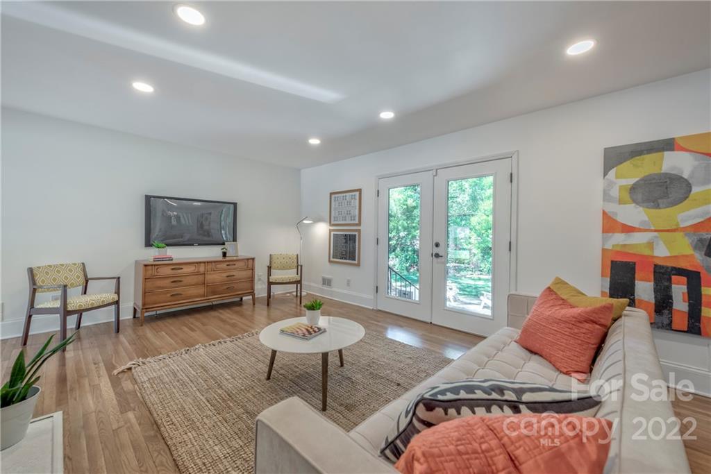 1139 Shady Bluff Drive Charlotte, NC 28211 - Photo 15 of 46 a living room with furniture and a floor to ceiling window
