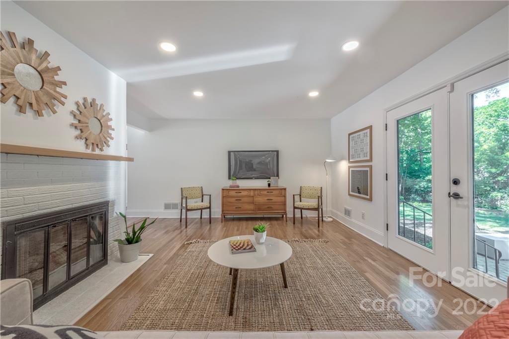 1139 Shady Bluff Drive Charlotte, NC 28211 - Photo 17 of 46 a living room with furniture and a fireplace