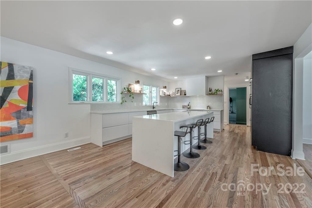 1139 Shady Bluff Drive Charlotte, NC 28211 - Photo 18 of 46 an open kitchen with kitchen island and stainless steel appliances