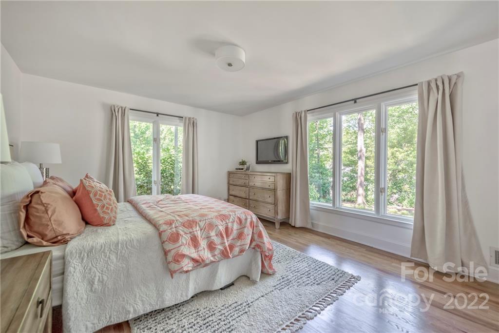 1139 Shady Bluff Drive Charlotte, NC 28211 - Photo 30 of 46 a bedroom with a large bed and a window