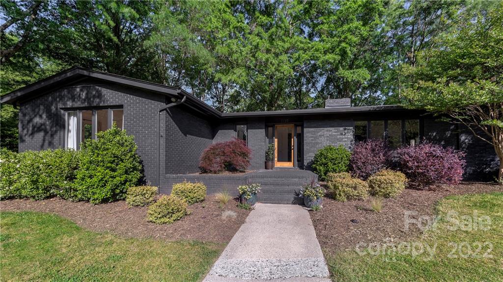 1139 Shady Bluff Drive Charlotte, NC 28211 - Photo 45 of 46 a front view of a house with garden