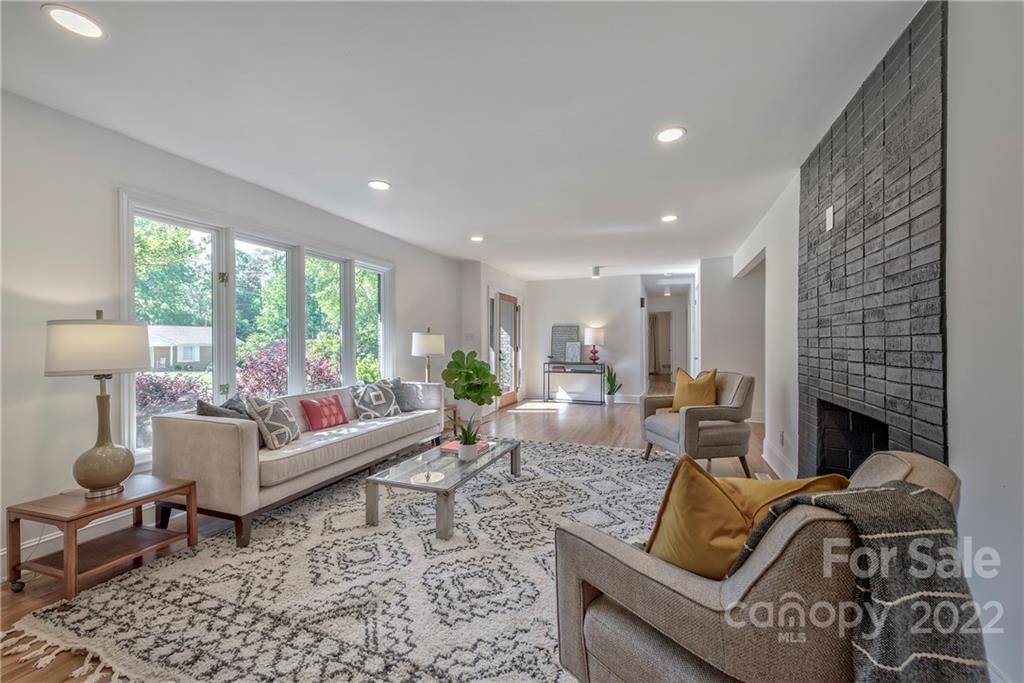 1139 Shady Bluff Drive Charlotte, NC 28211 - Photo 6 of 46 a living room with furniture and a fireplace