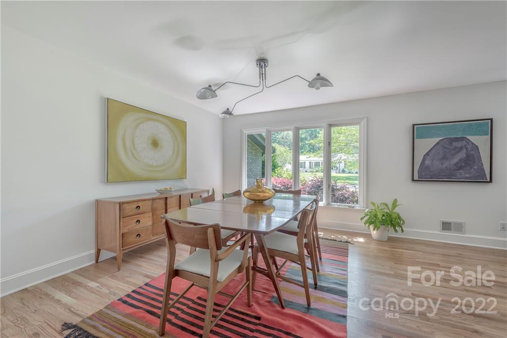 1139 Shady Bluff Drive Charlotte, NC 28211 - Photo 9 of 46 a view of a dining room with furniture window and wooden floor
