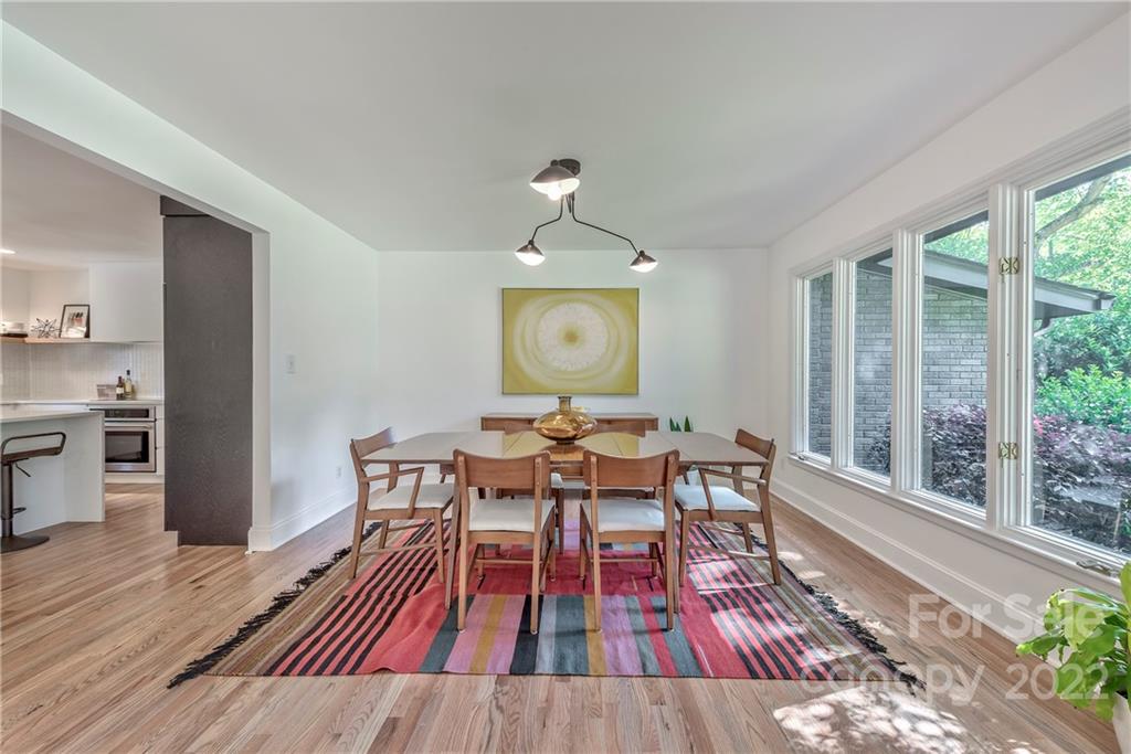 1139 Shady Bluff Drive Charlotte, NC 28211 - Photo 10 of 46 a view of a dining room with wooden floor and a rug