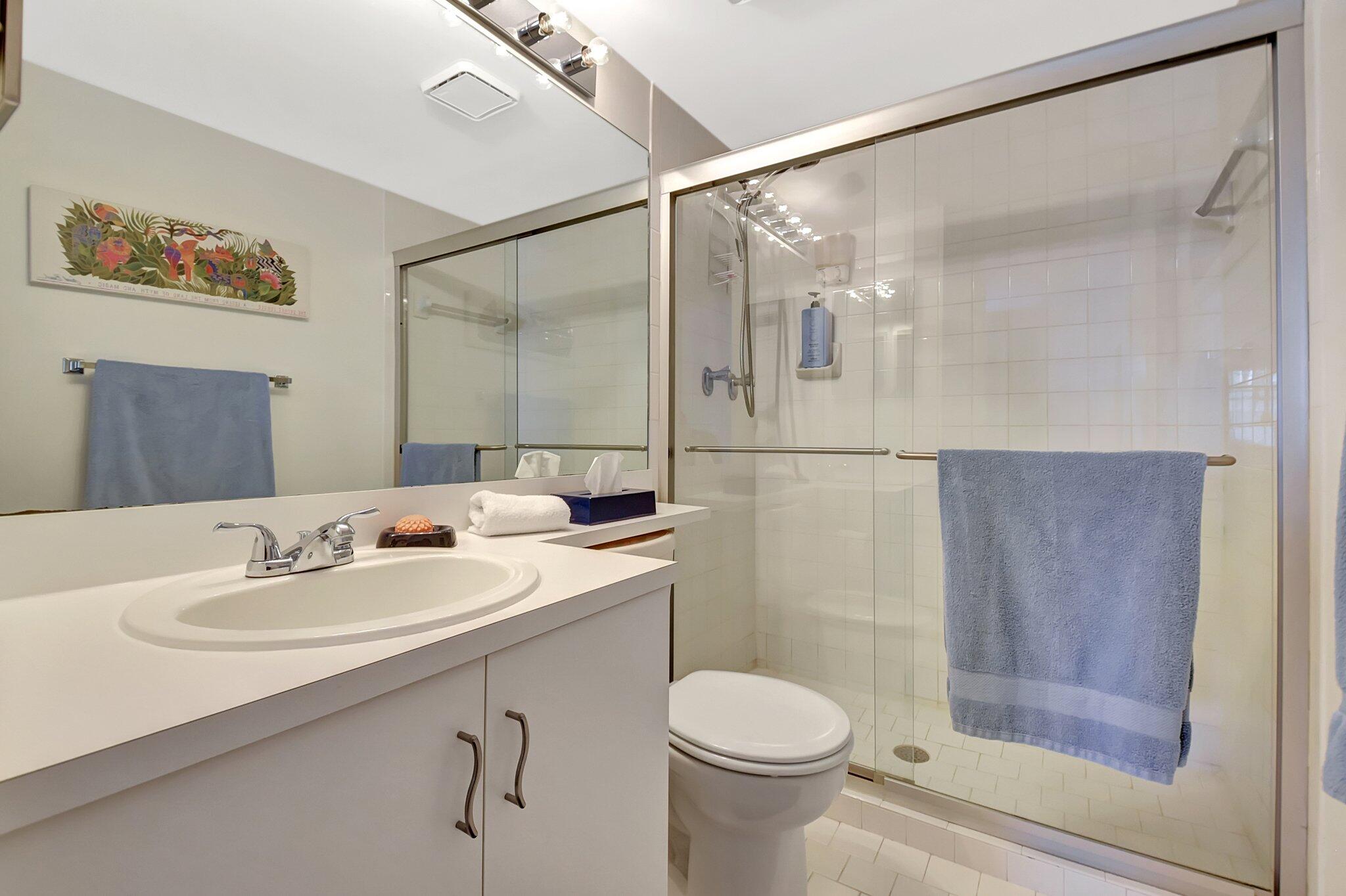 621 Waterside Drive Hypoluxo, FL 33462 - Photo 11 of 27 a bathroom with a sink toilet and shower