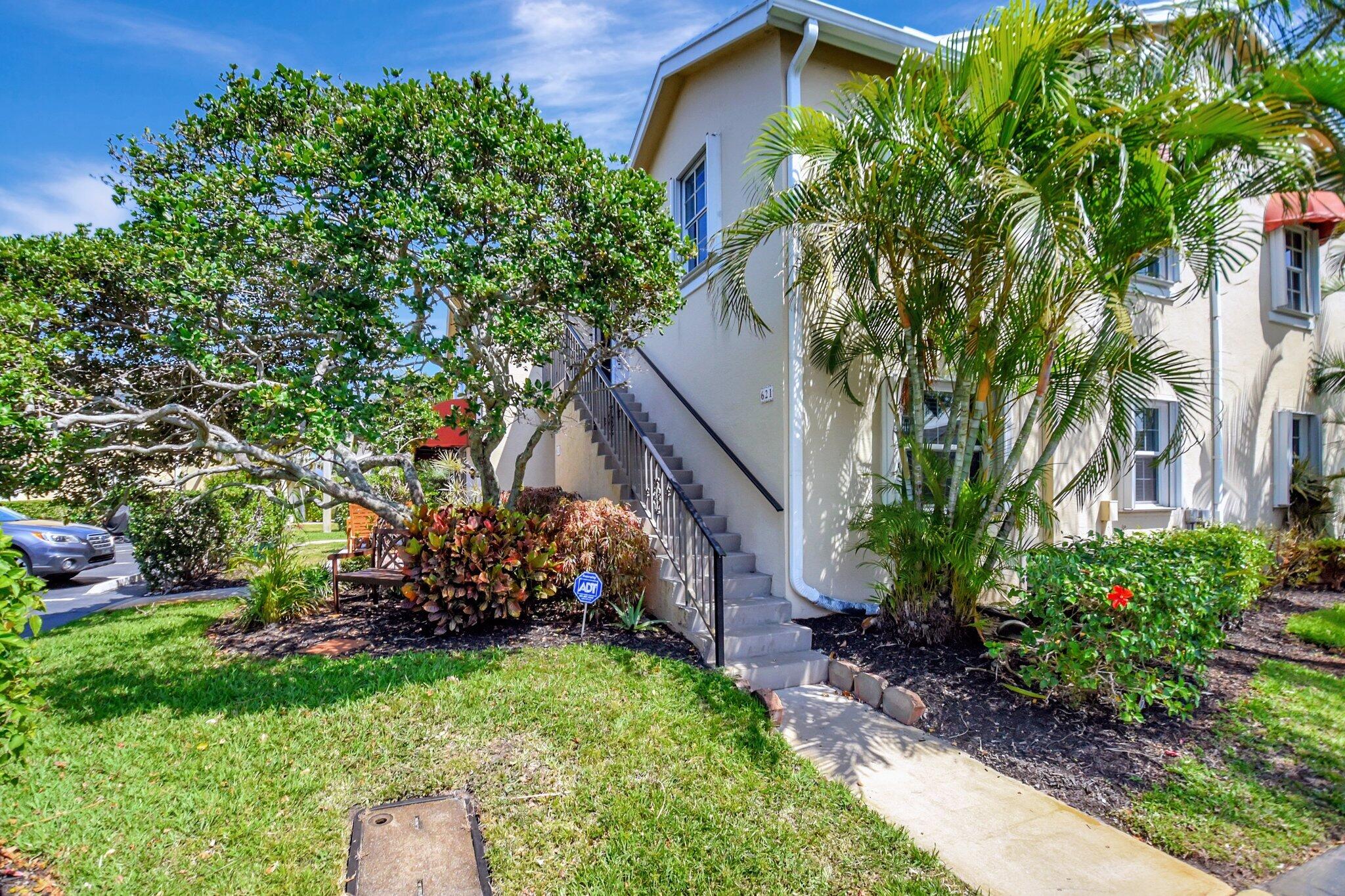 621 Waterside Drive Hypoluxo, FL 33462 - Photo 17 of 27 a view of a house with a yard