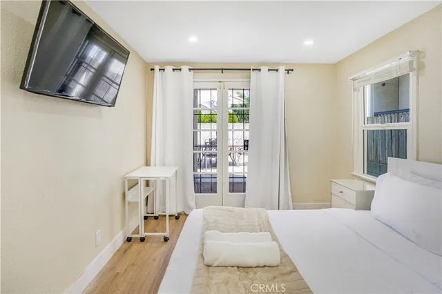 a bed room with a bed window and television