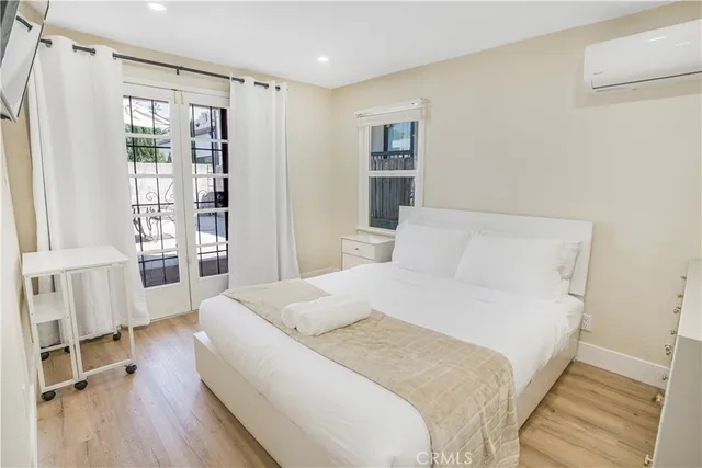 a large white bed in a white room