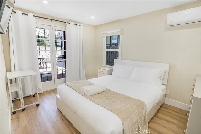 a large white bed in a white room