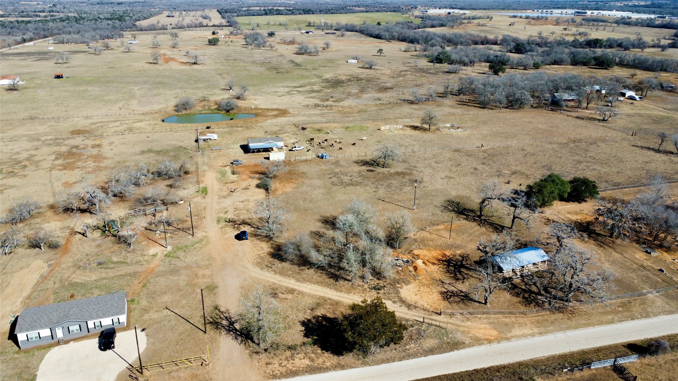 5633 Tenney Creek Road Luling, TX 78648 - Photo 2 of 14 Aerial overview of property's location with rural landscape and a nearby body of water