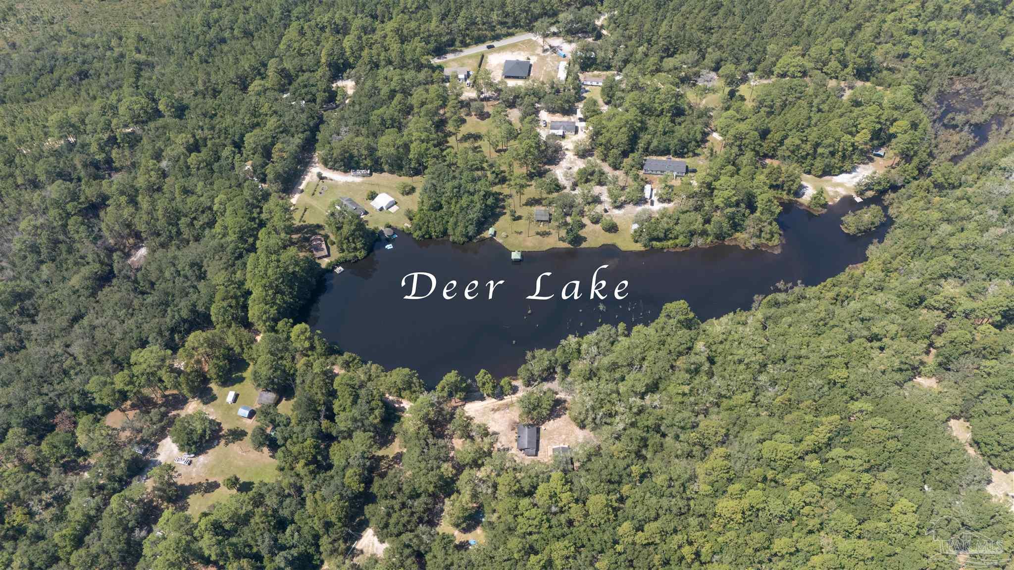Opossum Trail Milton, FL 32583 - Photo 2 of 2 a view of a sign under a tree