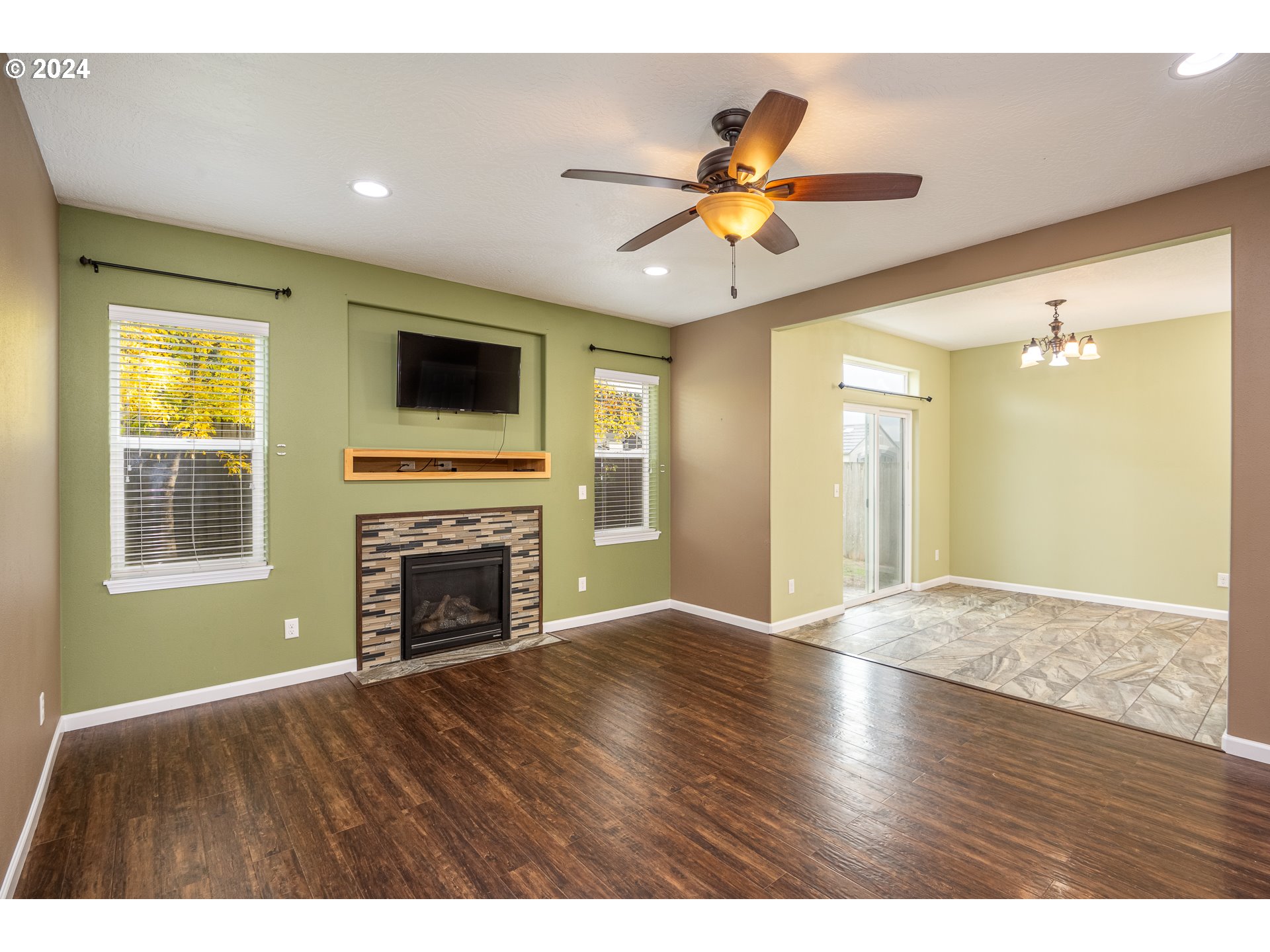 1455 South 58th Street Springfield, OR 97478 - Photo 13 of 39 a view of an empty room with window and wooden floor