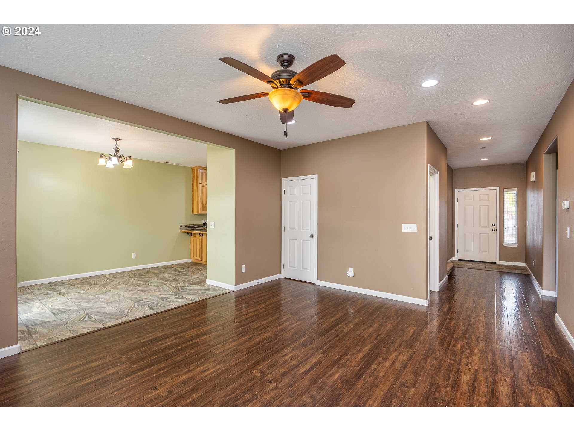 1455 South 58th Street Springfield, OR 97478 - Photo 15 of 39 a view of an empty room with window and wooden floor