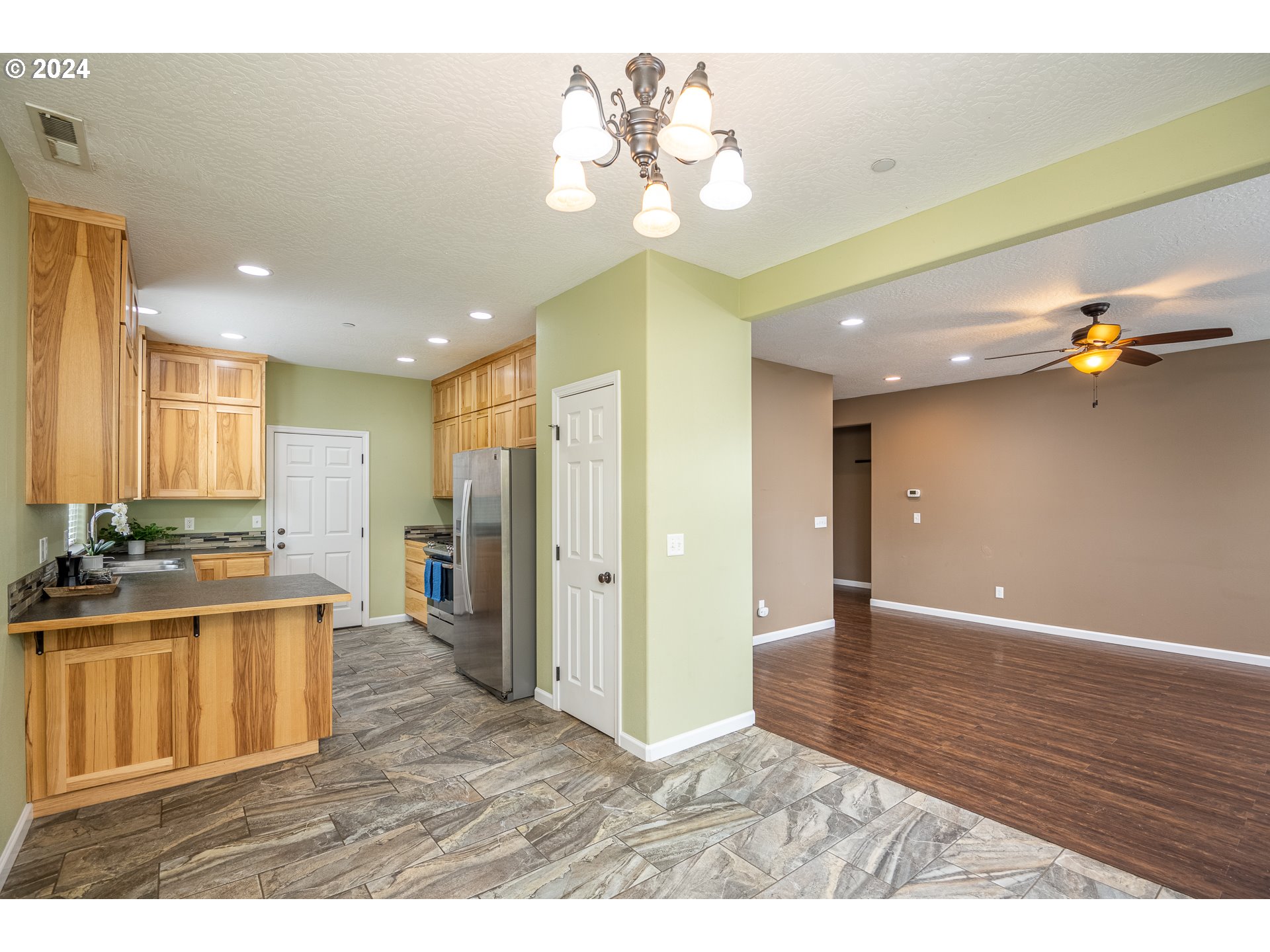 1455 South 58th Street Springfield, OR 97478 - Photo 16 of 39 a view interior of a house hardwood floor and a chandelier