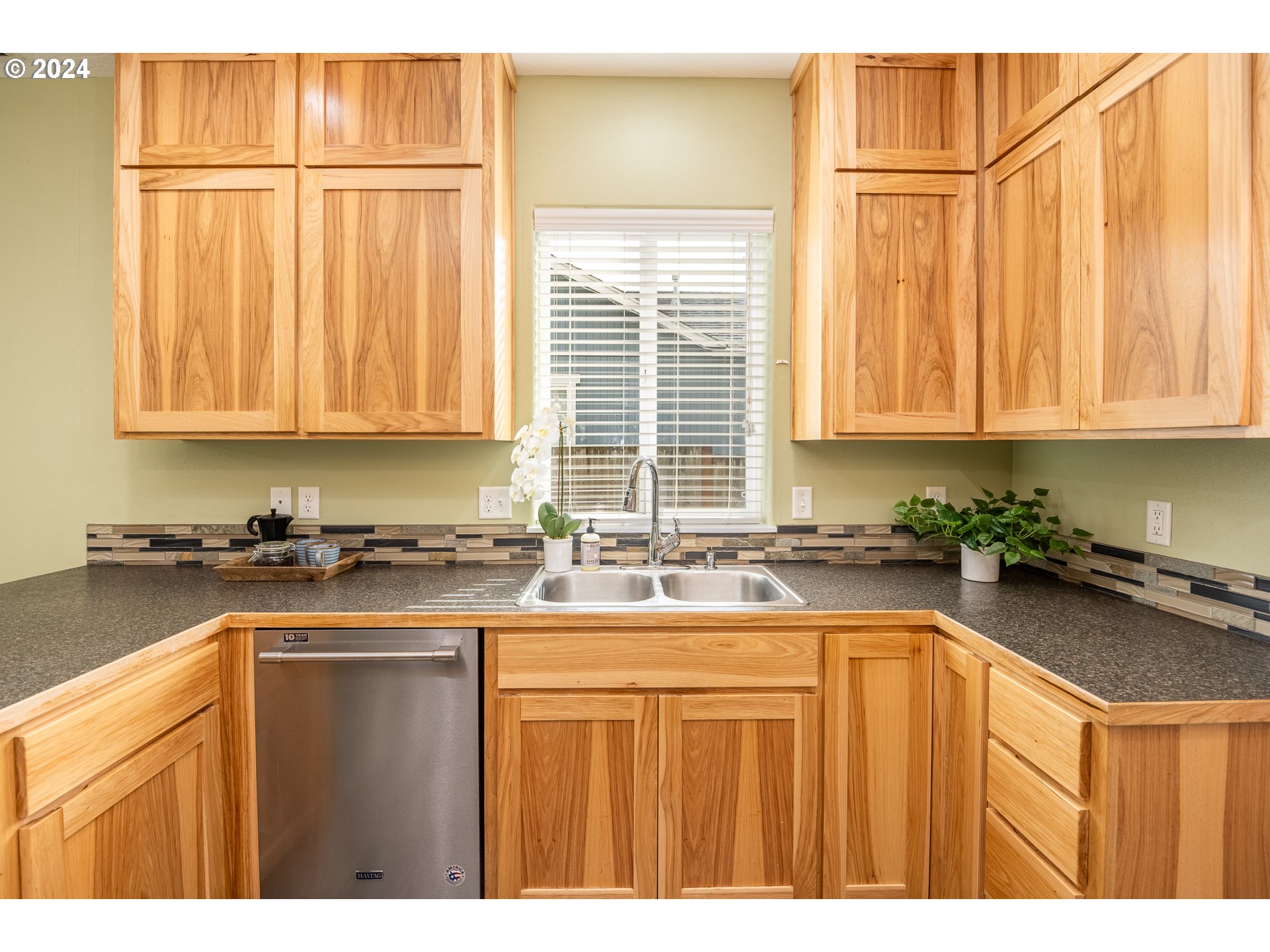 1455 South 58th Street Springfield, OR 97478 - Photo 18 of 39 a kitchen with a sink stove and cabinets