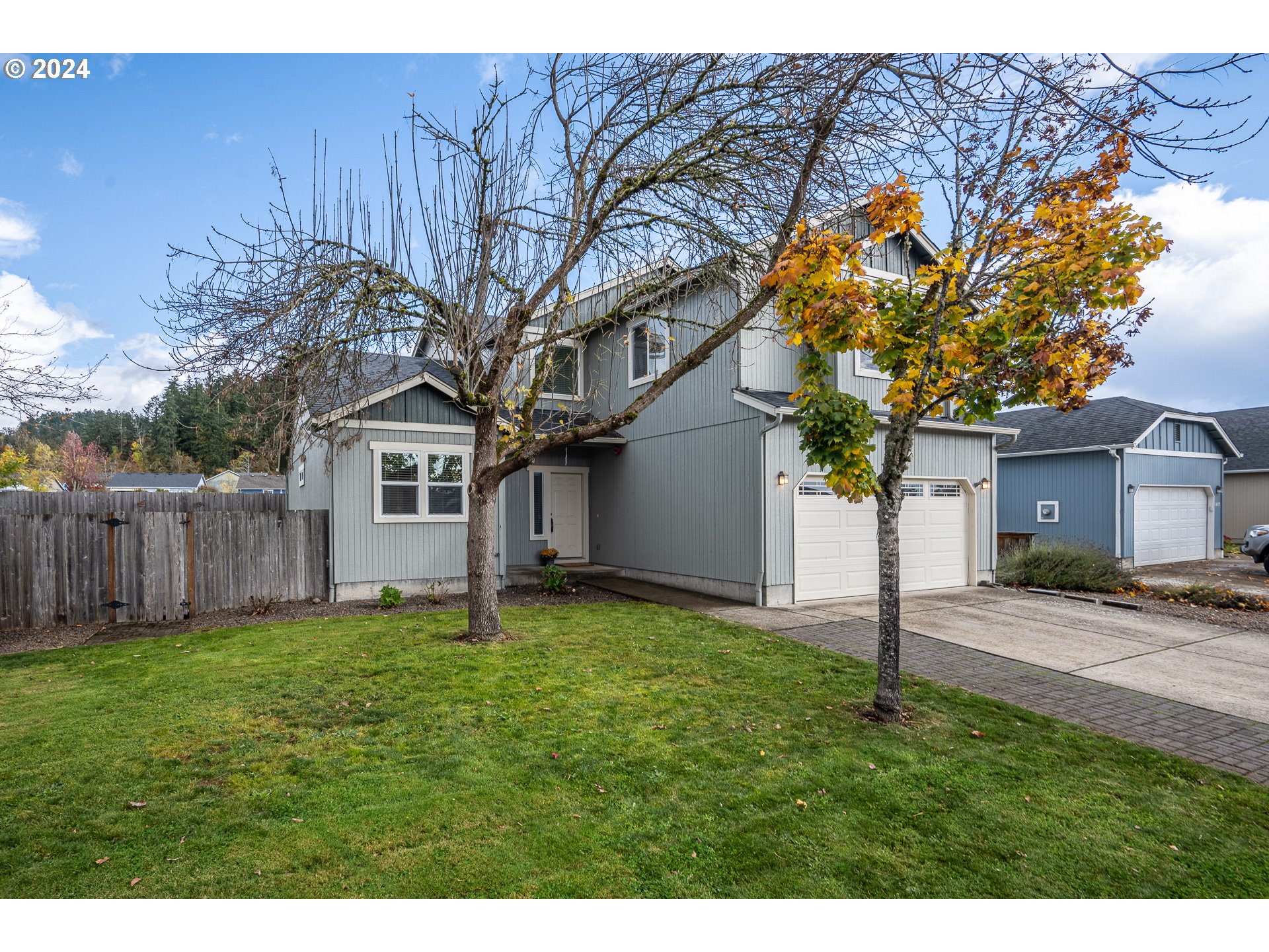 1455 South 58th Street Springfield, OR 97478 - Photo 2 of 39 a house with a tree in front of it