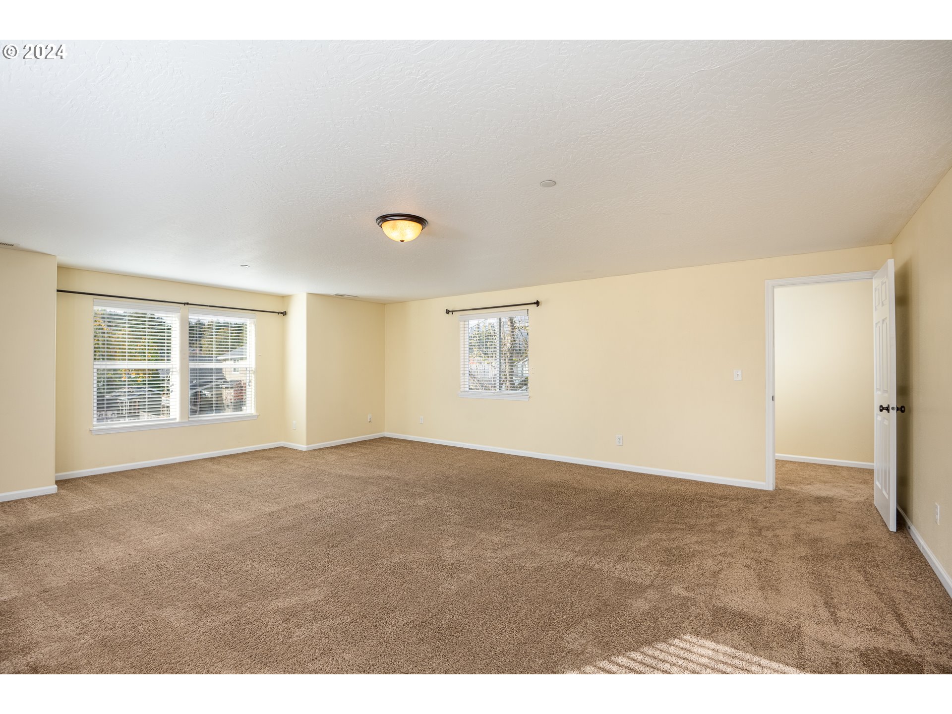 1455 South 58th Street Springfield, OR 97478 - Photo 25 of 39 a view of an empty room with wooden floor and a window