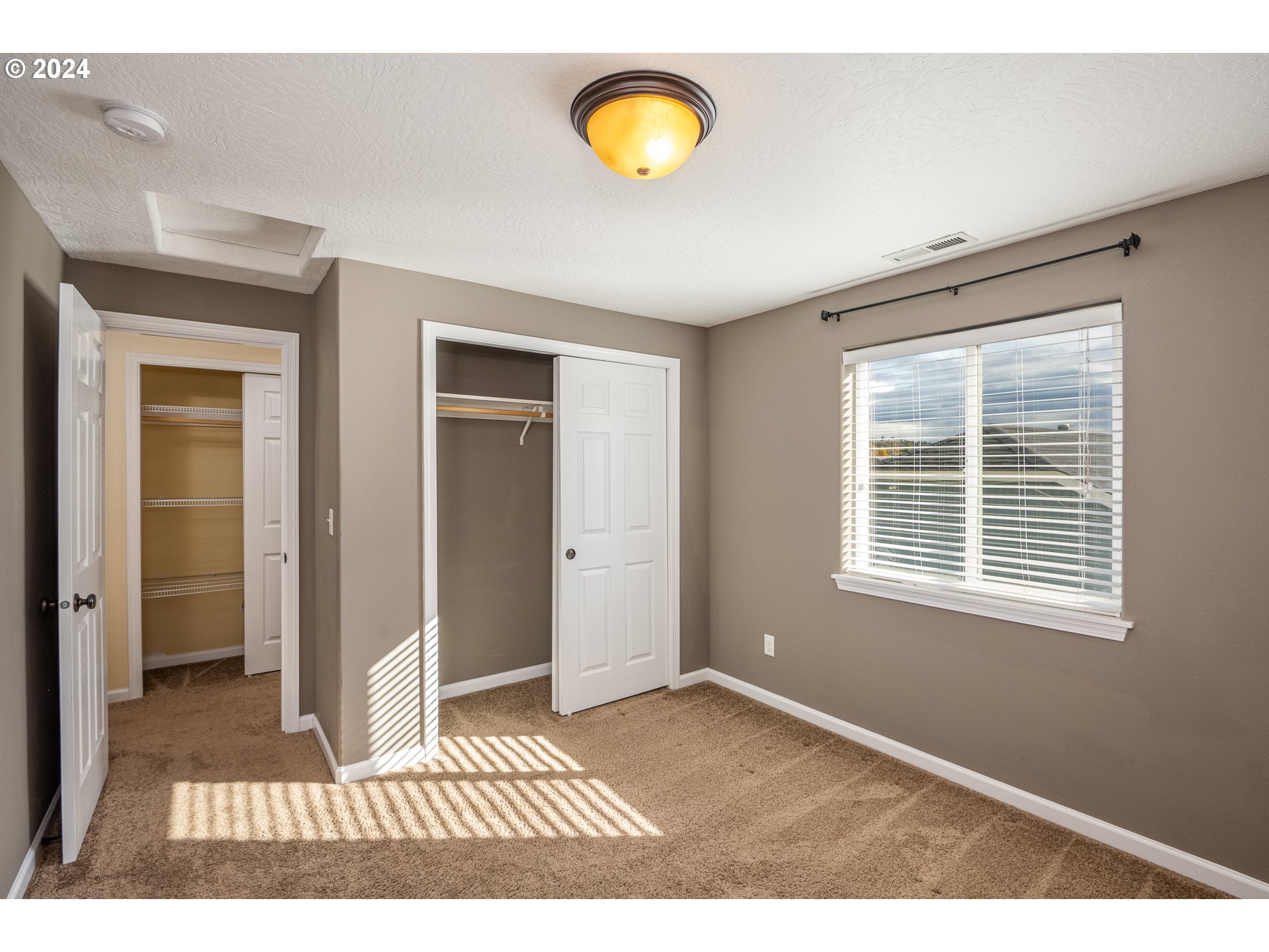 1455 South 58th Street Springfield, OR 97478 - Photo 30 of 39 a view of an empty room with window and closet