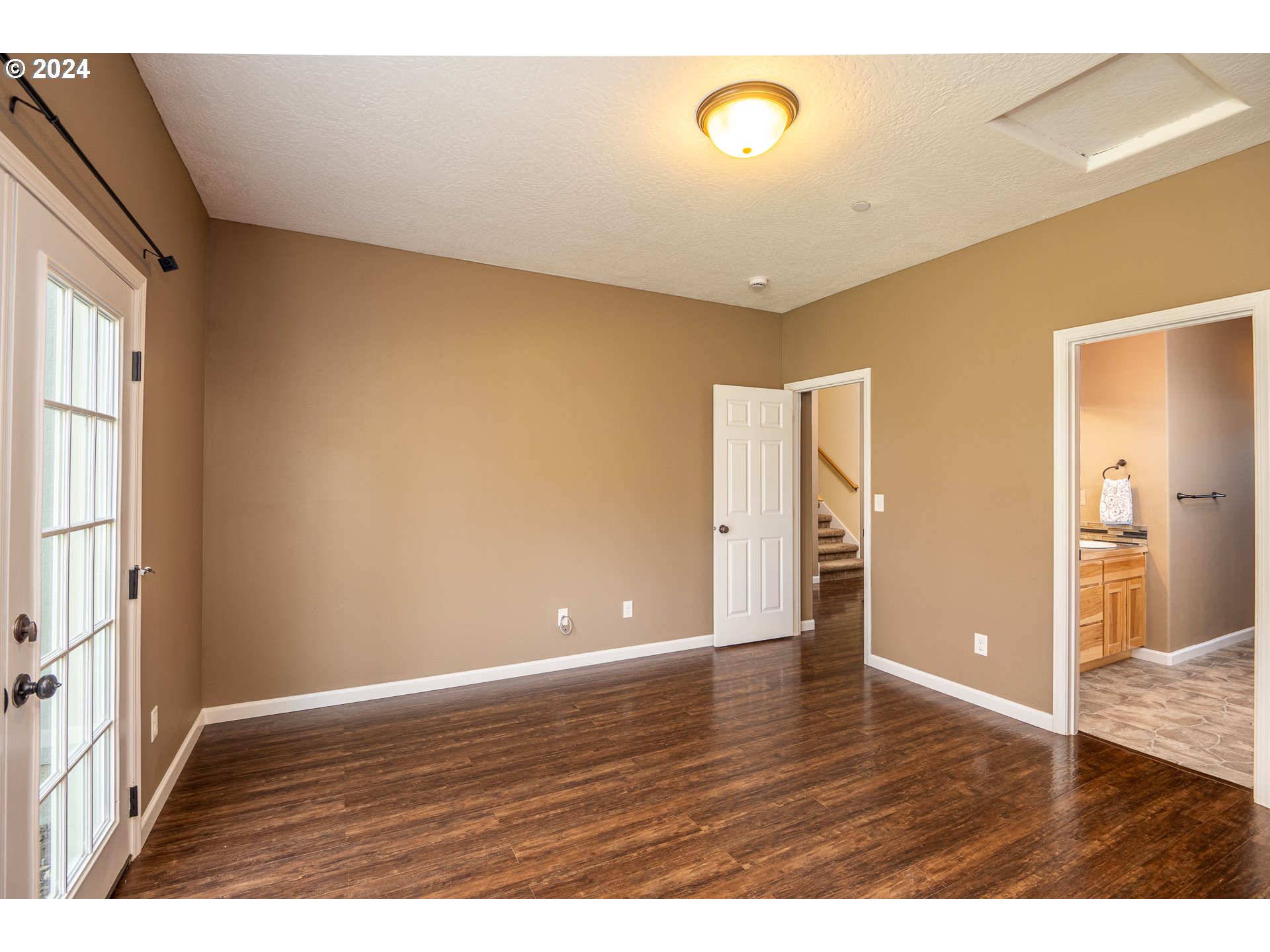 1455 South 58th Street Springfield, OR 97478 - Photo 5 of 39 a view of an empty room with wooden floor