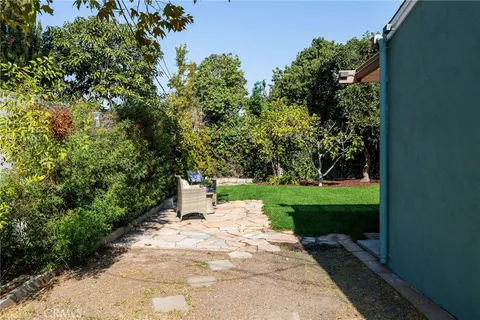 a view of a garden with a bench