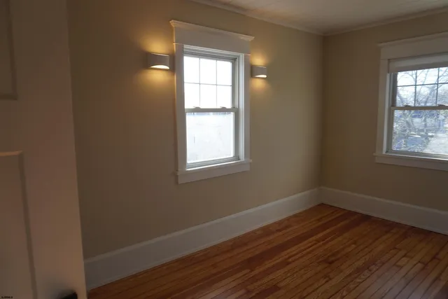a room with window and wooden floor