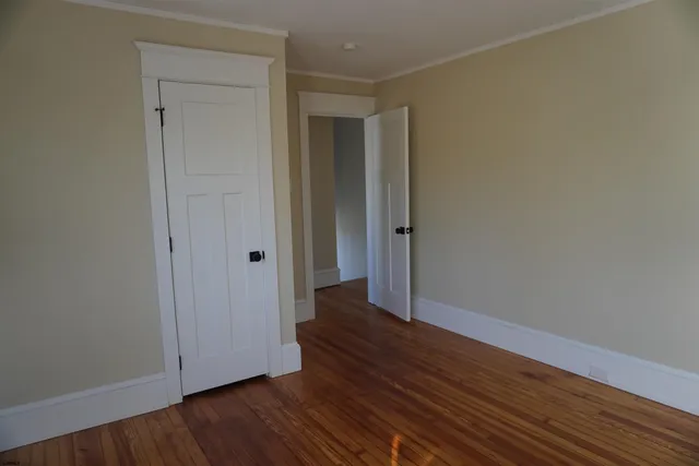 a view of wooden floor in an empty room