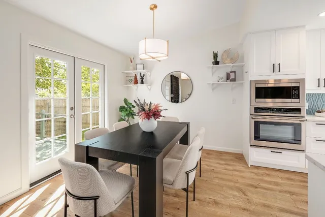a view of a dining room with furniture window and wooden floor