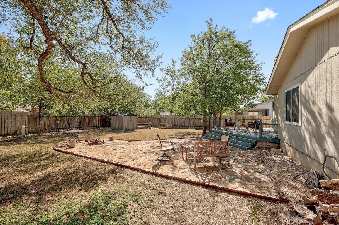 12511 Tree Line Drive Austin, TX 78729 - Photo 18 of 19 a view of a backyard that has a tree on the side