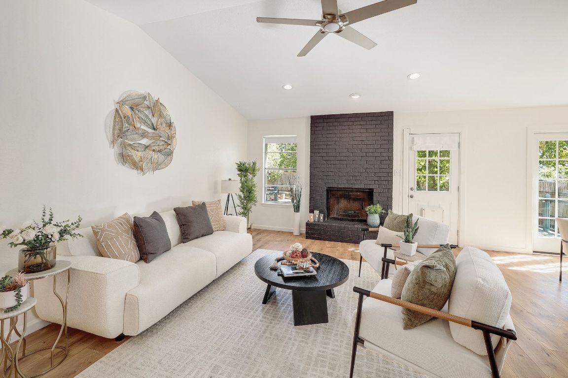 12511 Tree Line Drive Austin, TX 78729 - Photo 7 of 19 a living room with furniture and a fireplace