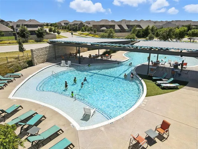 a view of a swimming pool with a patio