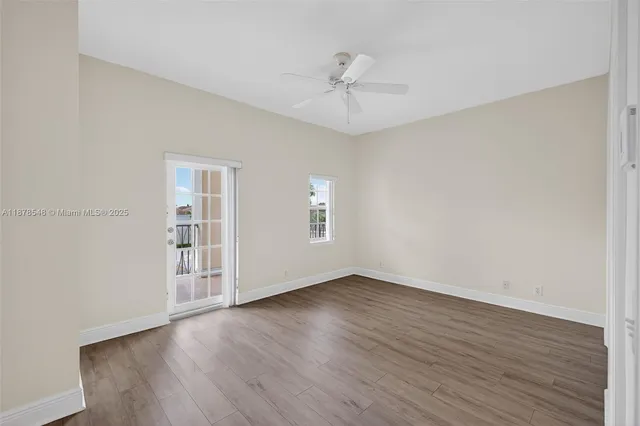 a view of a balcony with wooden floor