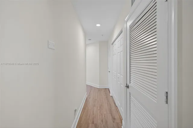 a front view of multiple houses with yard