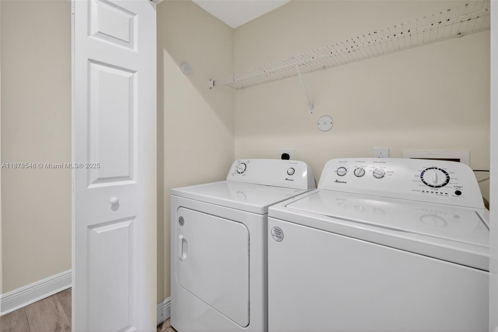 27 Southwest 6th Court Pompano Beach, FL 33060 - Photo 30 of 70 a view of washer and dryer with bathroom in the background