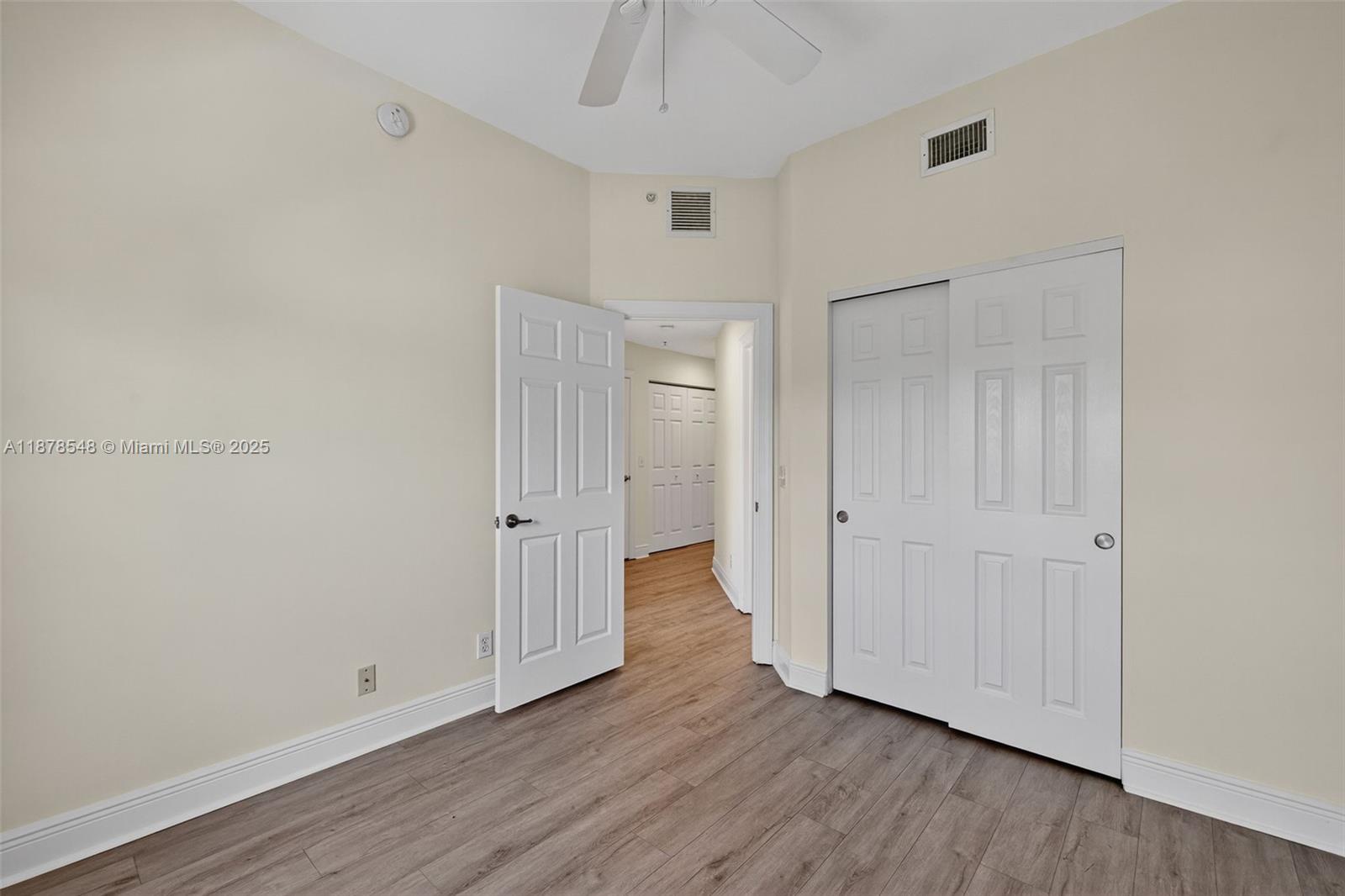 27 Southwest 6th Court Pompano Beach, FL 33060 - Photo 35 of 70 a view of empty room with wooden floor