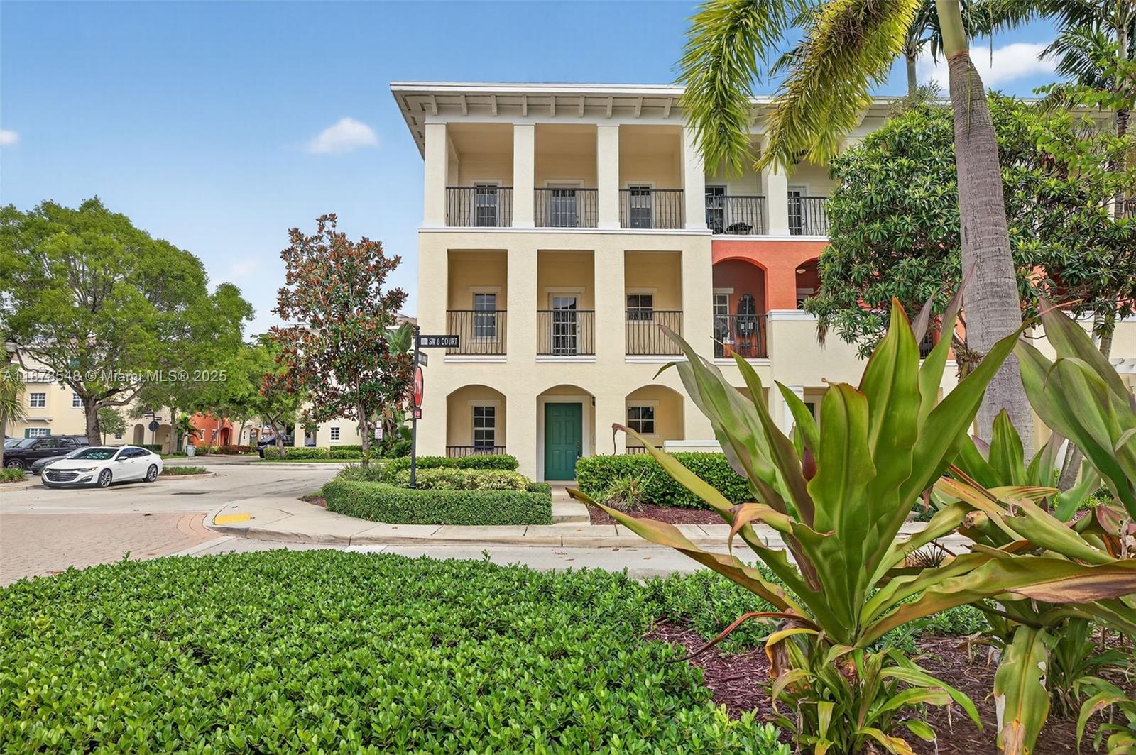 27 Southwest 6th Court Pompano Beach, FL 33060 - Photo 37 of 70 a front view of a house with a garden