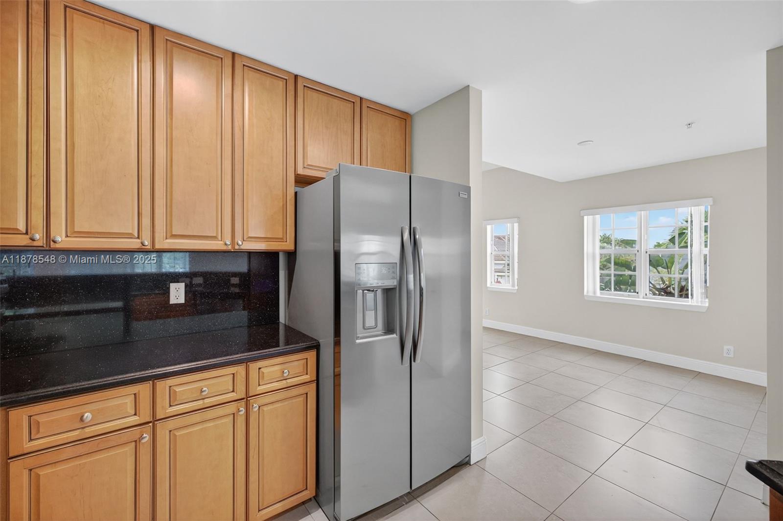 27 Southwest 6th Court Pompano Beach, FL 33060 - Photo 4 of 70 a kitchen with stainless steel appliances granite countertop a refrigerator and a sink